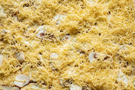 home made pizza raw ingredients cheese and mushrooms food photography background top viewの写真素材