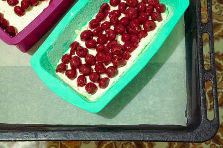 rural rustic home made cherry pie on tray in kitchen food photography top viewの写真素材