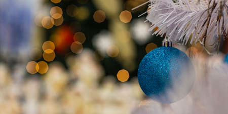 Christmas time concept post cart concept wallpaper pattern of white needle branch with blue ball decorative toy and garland lights unfocused bokeh golden illumination background empty copy space textの写真素材