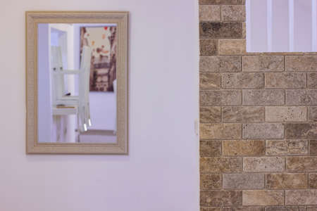 white and brick wall interior environment with mirrorの写真素材