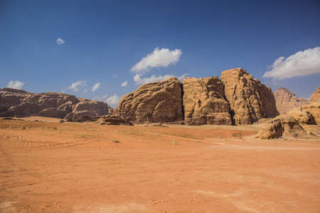 picturesque vivid yellow and orange colorful sunny Utah desert scenery landscape with mountain ridge backgroundの写真素材