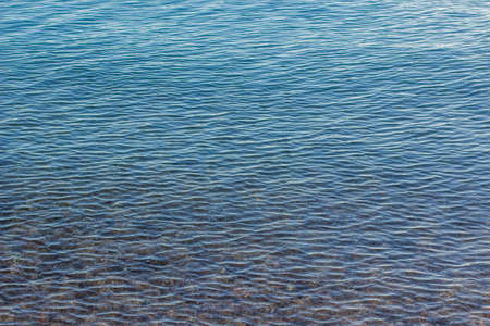calm water background shallow bottom scenic view, copy spaceの写真素材
