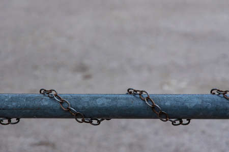 steel pipe iron chains industrial object blurred unfocused background pattern copy space fenced areaの写真素材