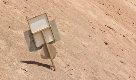 abandoned crushed old rust road sign in desert dunes near highway through Middle East country side space, bad landscaping concept photography wallpaper pattern with empty space for copyの写真素材
