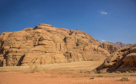 aerial top view desert landscape of Jordanian Wadi Rum famous touristic destination sand valley and gorgeous picturesque rocky mountains copy spaceの写真素材