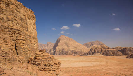 Wadi Rum Jordan Middle East desert landscape sand valley surrounded by stone rocky mountains foreground and backgroundの写真素材
