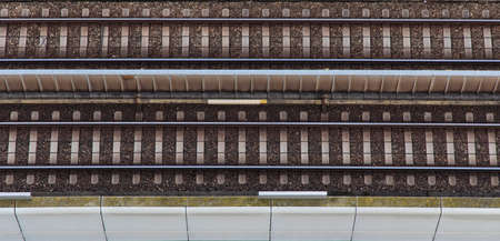 aerial top view railway road train transportation route from above industrial symmetry wallpaper pattern backgroundの写真素材
