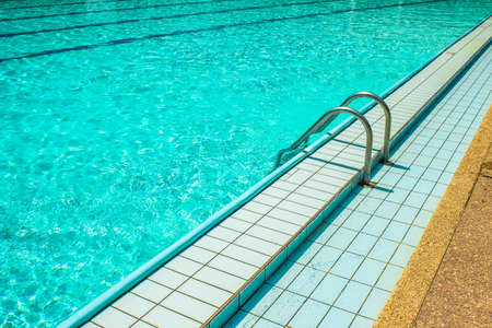 swimming pool stairs luxury resort open air space for relaxation in summer vacation season time in clear bright sunny weather, copy spaceの写真素材