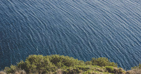 aerial scenery landscape photography of rocky sea coast view from top of cape with empty copy space for your text hereの写真素材