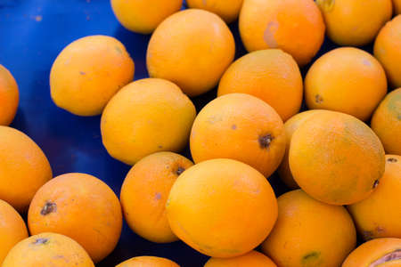 soft focus tropic fresh orange fruit objects background concept open air market counterの写真素材