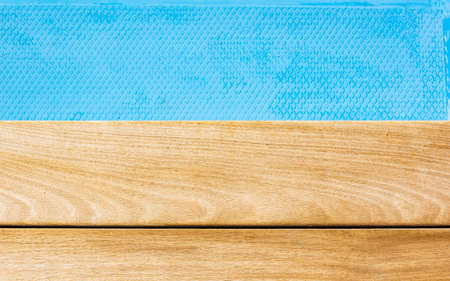 simple background wood material deck floor textured surface and classic blue water wallpaper patter mock up space for copy or your text hereの写真素材