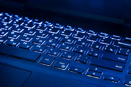 laptop keyboard dark blue illumination trendy color year 2020 computer technology object background...
