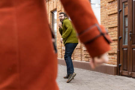 satire caricature concept of family relationships violence female fist and ridiculous funny scared husband street photographyの写真素材