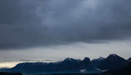 soft focus dramatic rocky mountain ridge wilderness picturesque Alps panorama landscape background...