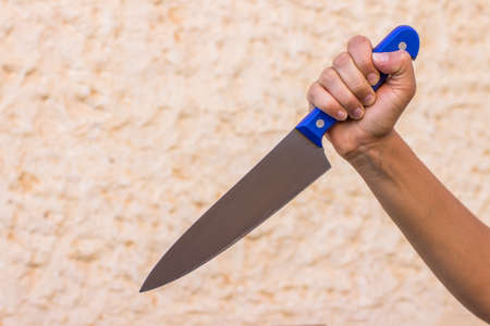 aggressive behavior transitional age teenager problems concept picture attack hit by young girl hand with kitchen knife as weapon copy space for your text hereの写真素材