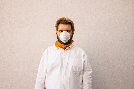 adult man in mask medicine respirator self protector object necessary in quarantine time neutral background wall space for copy or your text hereの写真素材
