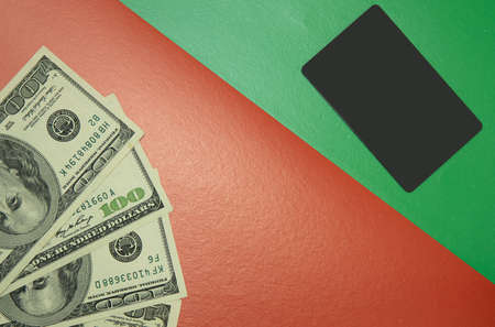 credit card with cash money more comfortable finance using concept picture on red and green paper...