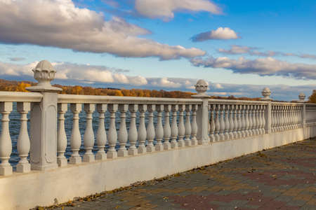 autumn waterfront walk side area urban scenic view place without people here in quarantine time, september orange and yellow moody colors cloudy weather dayの写真素材