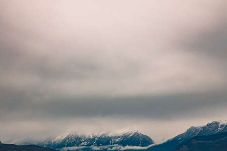 soft focus mountain landscape moody foggy dramatic weather time nature gorgeous scenic view with gray sky background and empty copy space for your text hereの写真素材