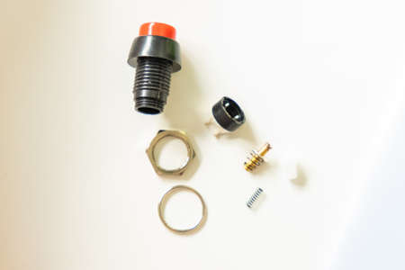 repair hand work details parts nuts screws and screws on white table surface