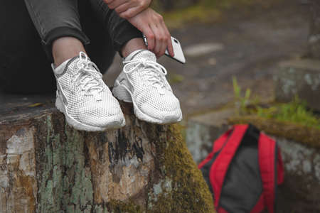 female white sneakers foot wear outdoor environment spaceの写真素材