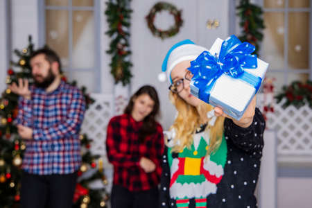 Christmas party with people and gifts