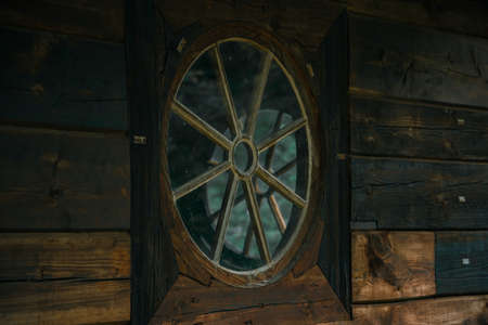 soft focus vintage circle shape window in old pagan wooden church buildingの写真素材