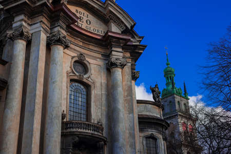 gothic church with Glory to God alone text on Latin language on exterior outdoor cold autumn bare trees branches environment spaceの写真素材
