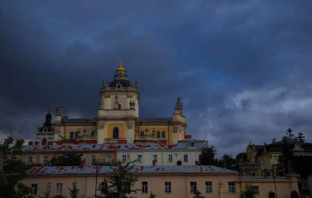 old church landmark urban view of UNESCO heritage site in Lviv Ukraine, dramatic moody cloudy sky...