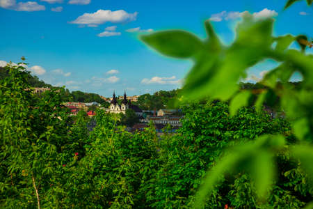 spring day bright and clear weather time outdoor landmark scenic view with tree foliage greenery space foreground and background old building objectsの写真素材