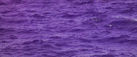 sea waves panorama background colored in very peri shade of purple artistic creative idea of nature scenic view and trendsの写真素材