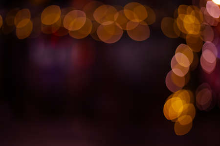 Christmas festive wallpaper simple pattern picture bokeh sparkles of garland lights in dusk, blurred...