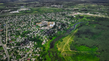 small Eastern Europe settlement city with ruins and not working plant outskirts area with...