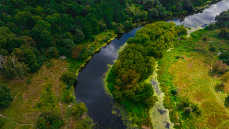 aerial landscape summer country side scenery photography top view from drone with woods field and river streamの写真素材