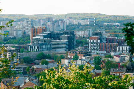 modern city Europe landmark drone aerial top view of office buildings green environment park and branches foreground spaceの写真素材