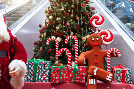 Christmas holidays decorations of Santa Claus and gifts in the mall festive atmosphere of December