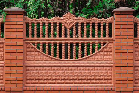 street fence architecture detail element red brick wall and upside down arch shape with columns background simple template outsideの写真素材