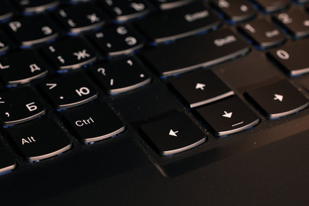 black laptop keyboard narrow focus buttons plastic device perspective surface