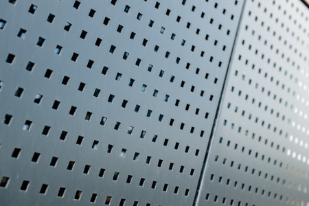 metallic wall fence square shape cells perspective point of view industrial background iron panels...