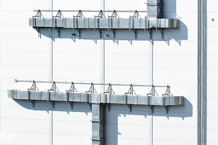 factory plant modern industrial exterior architecture walls side with metallic pipes external construction square shapes cabin objectの写真素材