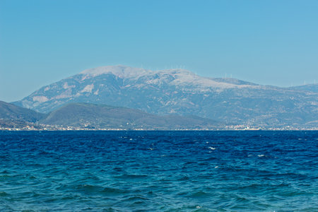 sea scape wavy water panorama landscape with mountain range in mist background view of summer day timeの写真素材