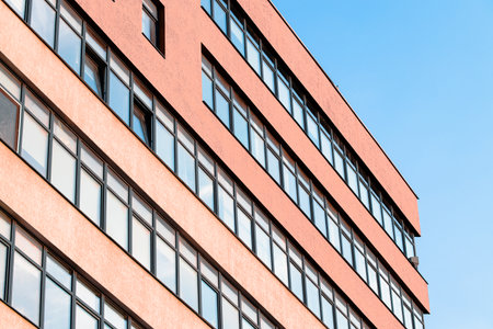 office working building exterior facade wall windows perspective side from belowの写真素材