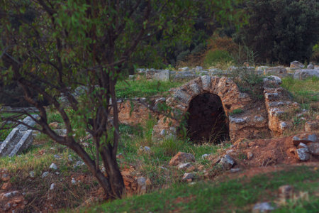 ancient ruins cave nature Greece outskirts country side view in evening sun lighting conditionの写真素材