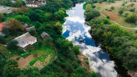 village country side aerial drone photography top view of summer settlement small house near river...
