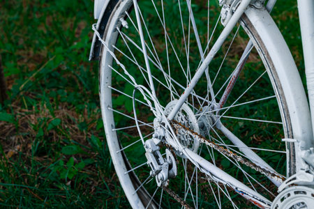 old abandoned rusty cycle with the same chain from wheel close up view outdoorの写真素材
