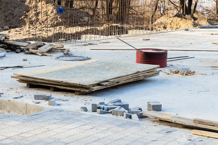 construction building materials road paved process and red metallic barrel grunge dirty industrial...