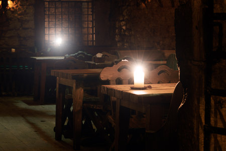 dark tavern indoor furniture fantasy aesthetic space without people here with candle light on tables