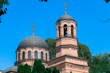 old church Balkan region architecture building domes objects in park green zone foreground frame and...