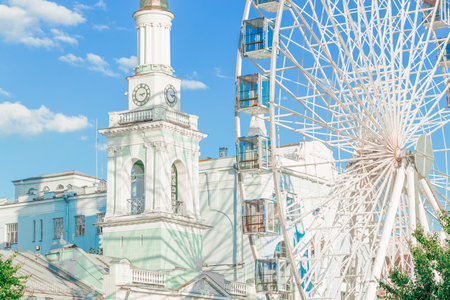 bright festive European city in Eastern Europe Ukraine country historical capital center with beautiful architecture and Ferris Wheelの写真素材