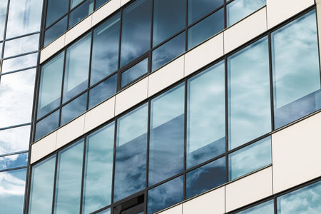 glass material skyscraper modern office external side facade building architecture textured perspective surface with dramatic colors cold toneの写真素材